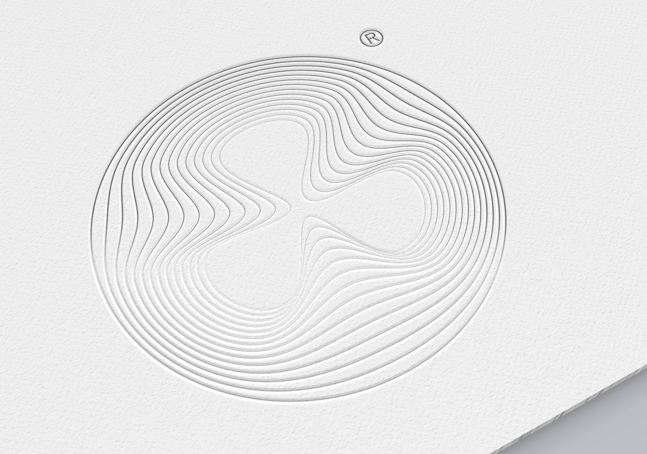 Experimental logo design using a warped circle shown as an embossed print