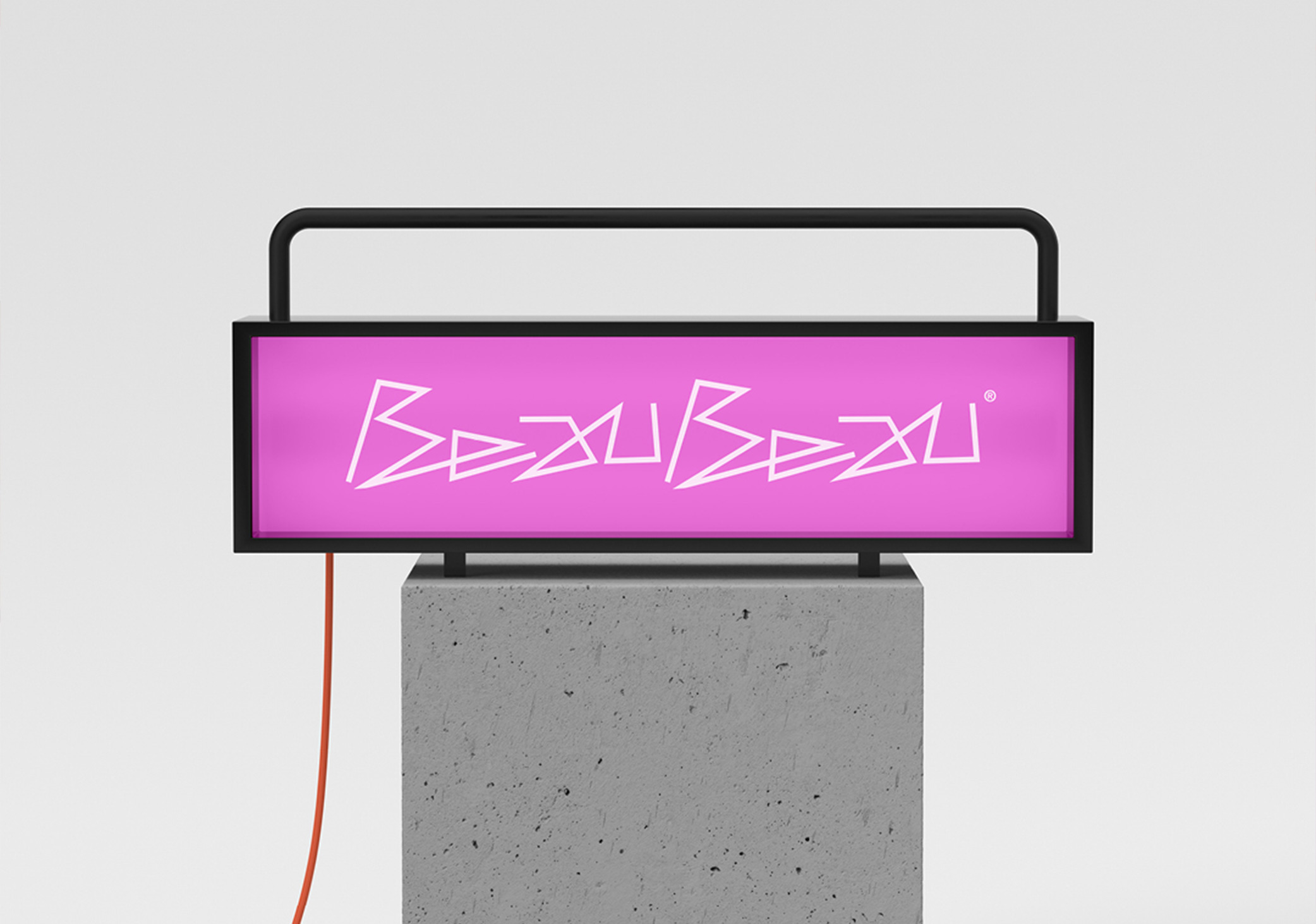 Experimental logo design shown on a neon light signage unit for company called Beau Beau